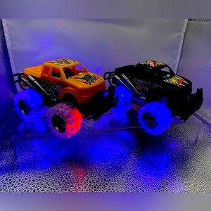 LED Light Up “Monster Trucks” Push & Go Quantity: 2 trucks